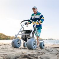 Man using WheelEEZ All-Terrain Rollator on sand